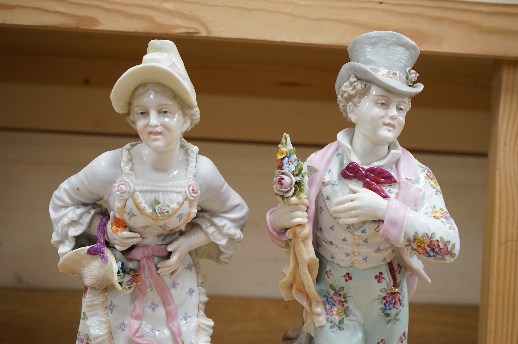 A pair of large Continental porcelain figures of a lady and gentleman, late 19th century, 41cm high